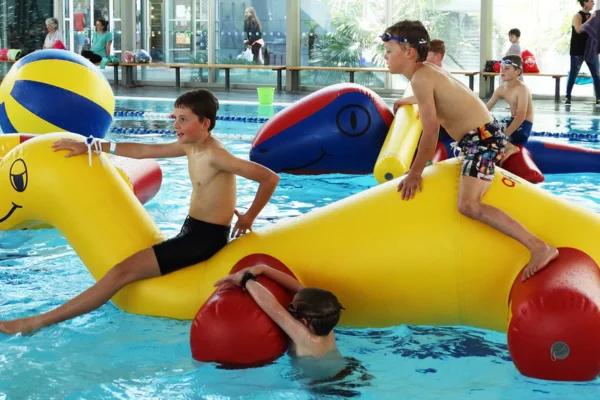 Dive Into Fun: Blue and Yellow Log Roller in the Pool
